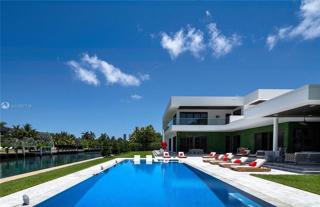 This Mansion in Golden Beach is a modern tropical oasis is situated on a wide canal with breathtaking water views available for sale. This home located at 660 N Island, Golden Beach, Florida