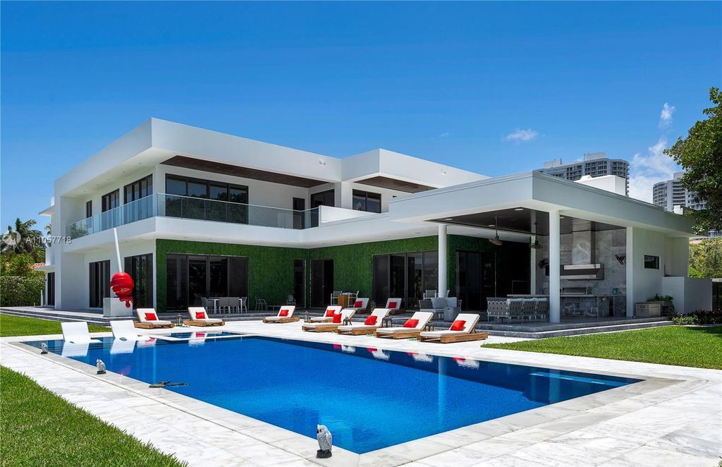 This Mansion in Golden Beach is a modern tropical oasis is situated on a wide canal with breathtaking water views available for sale. This home located at 660 N Island, Golden Beach, Florida