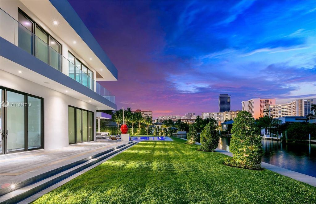 This Mansion in Golden Beach is a modern tropical oasis is situated on a wide canal with breathtaking water views available for sale. This home located at 660 N Island, Golden Beach, Florida