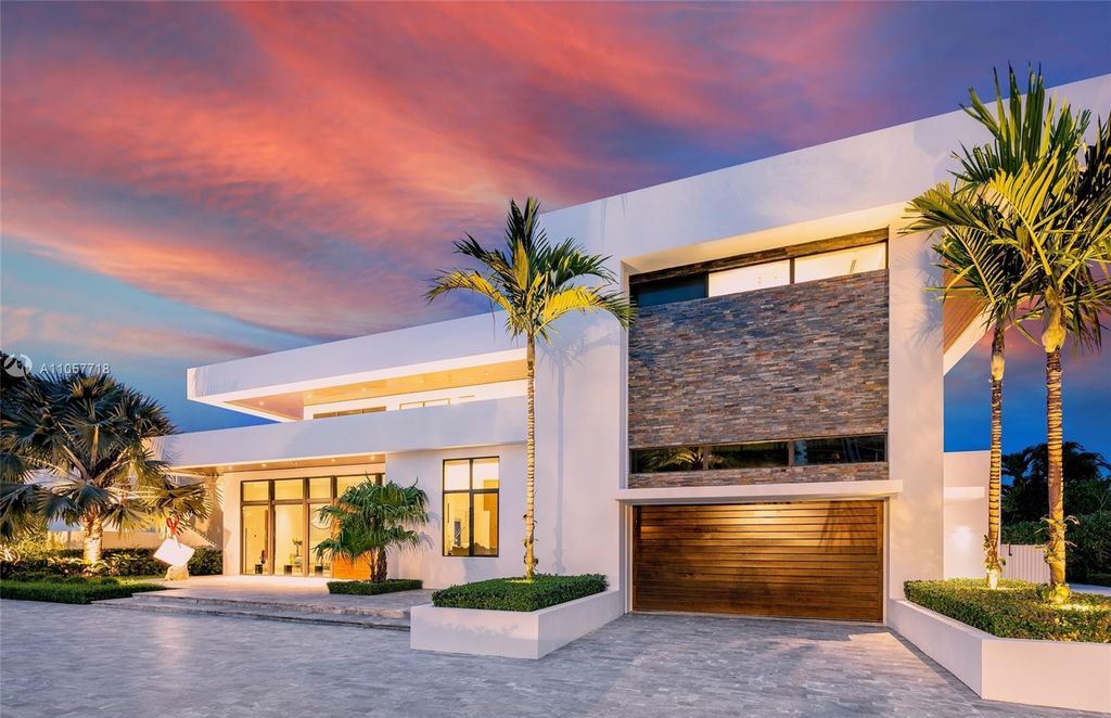 This Mansion in Golden Beach is a modern tropical oasis is situated on a wide canal with breathtaking water views available for sale. This home located at 660 N Island, Golden Beach, Florida