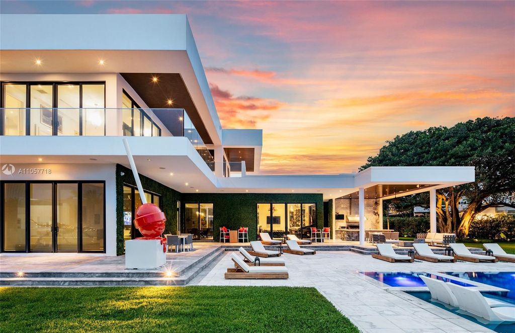This Mansion in Golden Beach is a modern tropical oasis is situated on a wide canal with breathtaking water views available for sale. This home located at 660 N Island, Golden Beach, Florida