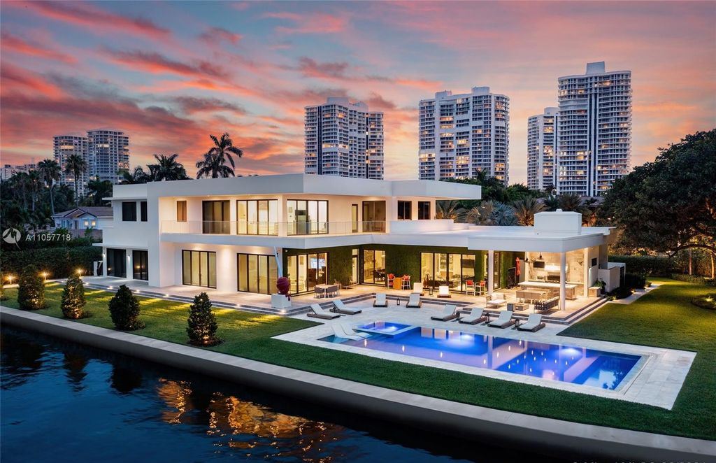 This Mansion in Golden Beach is a modern tropical oasis is situated on a wide canal with breathtaking water views available for sale. This home located at 660 N Island, Golden Beach, Florida