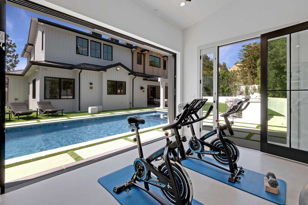 The Farmhouse in Los Angeles is a newly constructed modern property with sweeping views of the iconic Hollywood Sign now available for sale. This home located at 6310 Mirror Lake Dr, Los Angeles, California