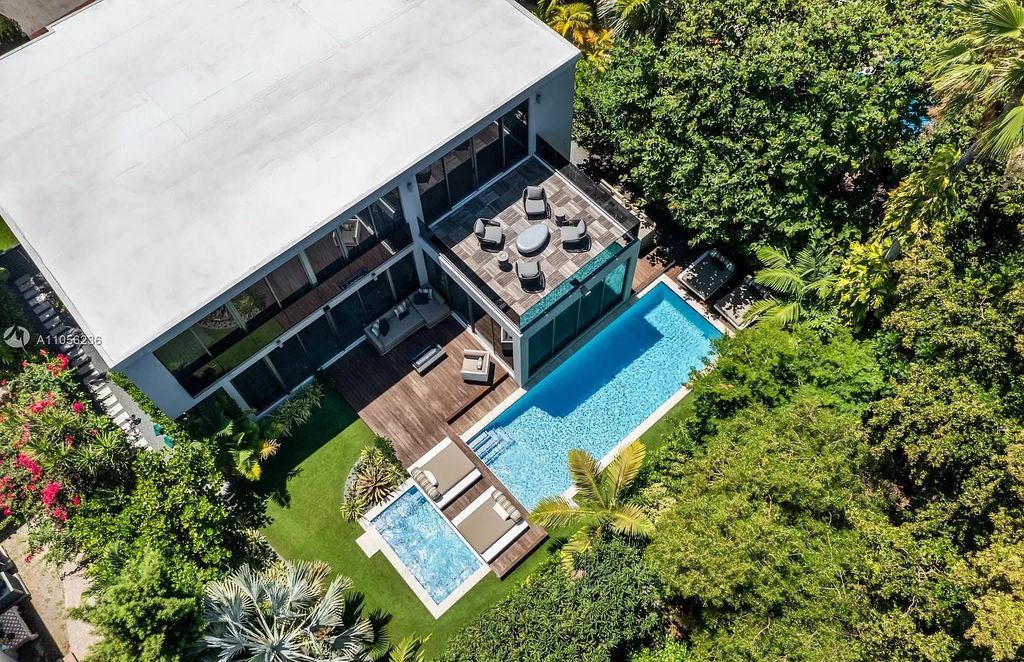 The Home in Miami Beach is a newly built tropical modern property has luxurious living space flawlessly connecting with the exterior now available for sale. This home located at 4535 Nautilus Ct, Miami Beach, Florida