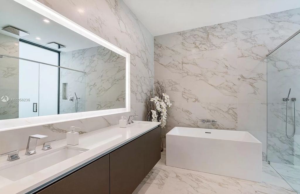 The Home in Miami Beach is a newly built tropical modern property has luxurious living space flawlessly connecting with the exterior now available for sale. This home located at 4535 Nautilus Ct, Miami Beach, Florida