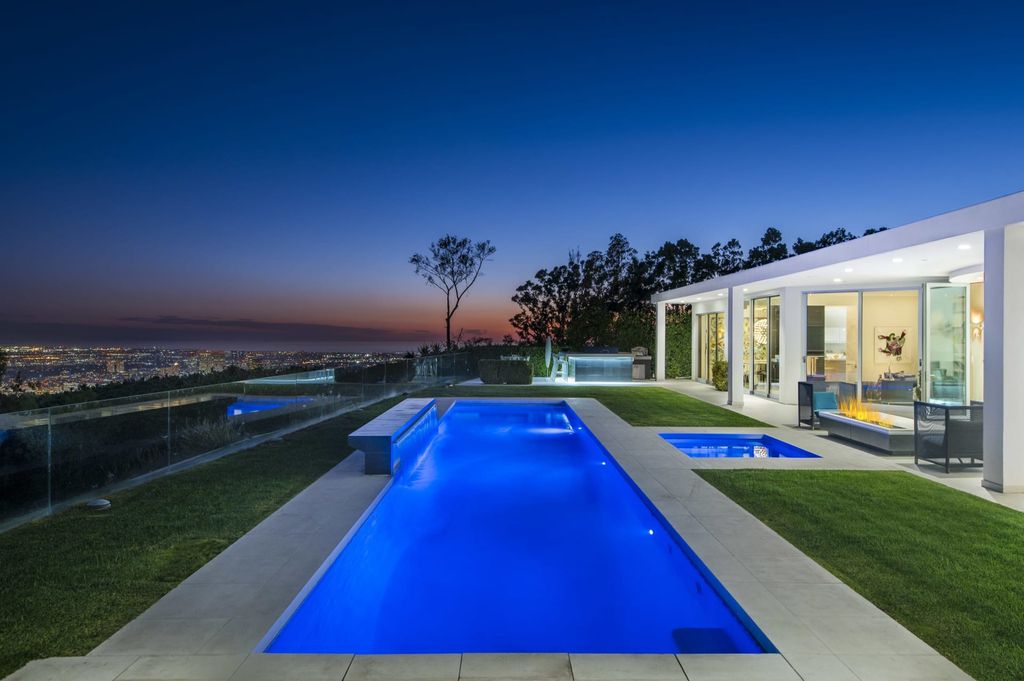 The Mid-century Contemporary Home in Beverly Hills situated on a prime city view rim lot in prestigious Trousdale Estates now available for sale. This home located at 1790 Carla Rdg, Beverly Hills, California