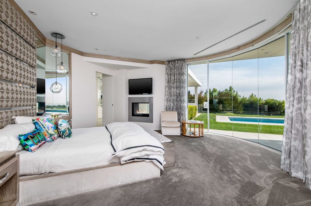 The Mid-century Contemporary Home in Beverly Hills situated on a prime city view rim lot in prestigious Trousdale Estates now available for sale. This home located at 1790 Carla Rdg, Beverly Hills, California