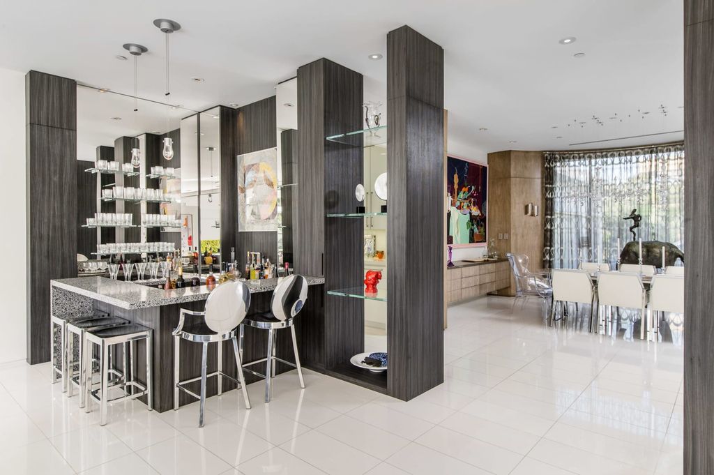 The Mid-century Contemporary Home in Beverly Hills situated on a prime city view rim lot in prestigious Trousdale Estates now available for sale. This home located at 1790 Carla Rdg, Beverly Hills, California