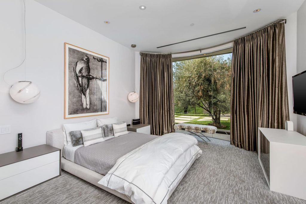 The Mid-century Contemporary Home in Beverly Hills situated on a prime city view rim lot in prestigious Trousdale Estates now available for sale. This home located at 1790 Carla Rdg, Beverly Hills, California