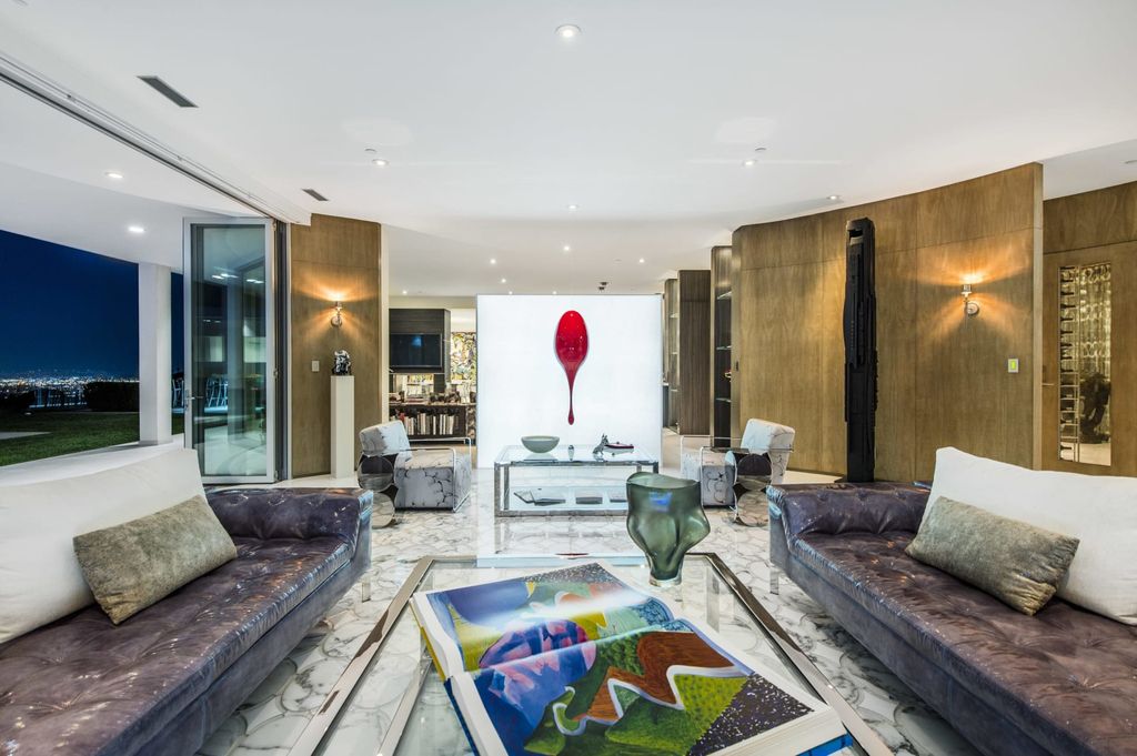 The Mid-century Contemporary Home in Beverly Hills situated on a prime city view rim lot in prestigious Trousdale Estates now available for sale. This home located at 1790 Carla Rdg, Beverly Hills, California