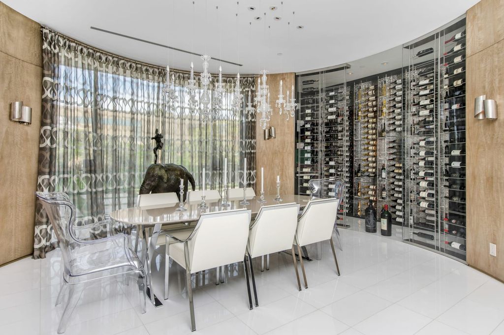 The Mid-century Contemporary Home in Beverly Hills situated on a prime city view rim lot in prestigious Trousdale Estates now available for sale. This home located at 1790 Carla Rdg, Beverly Hills, California