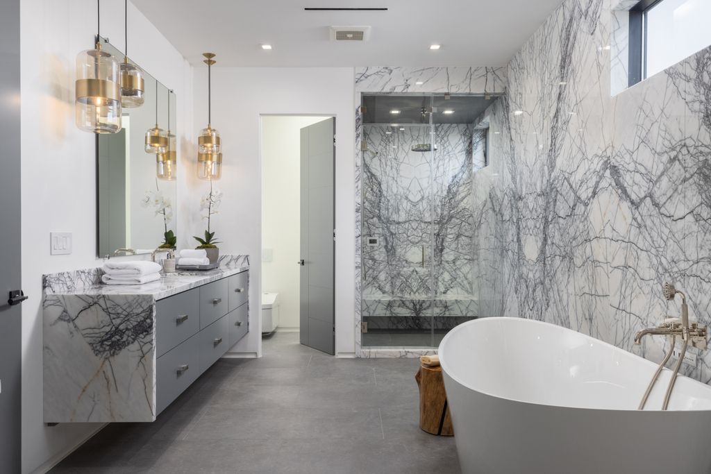 The Los Angeles Mansion is a luxurious lifestyle compound with multi-level outdoor entertaining spaces in Brentwood now available for sale. This home located at 499 Halvern Dr, Los Angeles, California