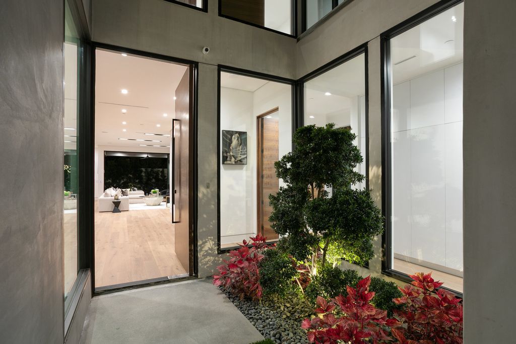 The Los Angeles Home is exquisite new construction modern gem offers sweeping open floorplan with a grand entrance now available for sale. This home located at 729 N Kilkea Dr, Los Angeles, California