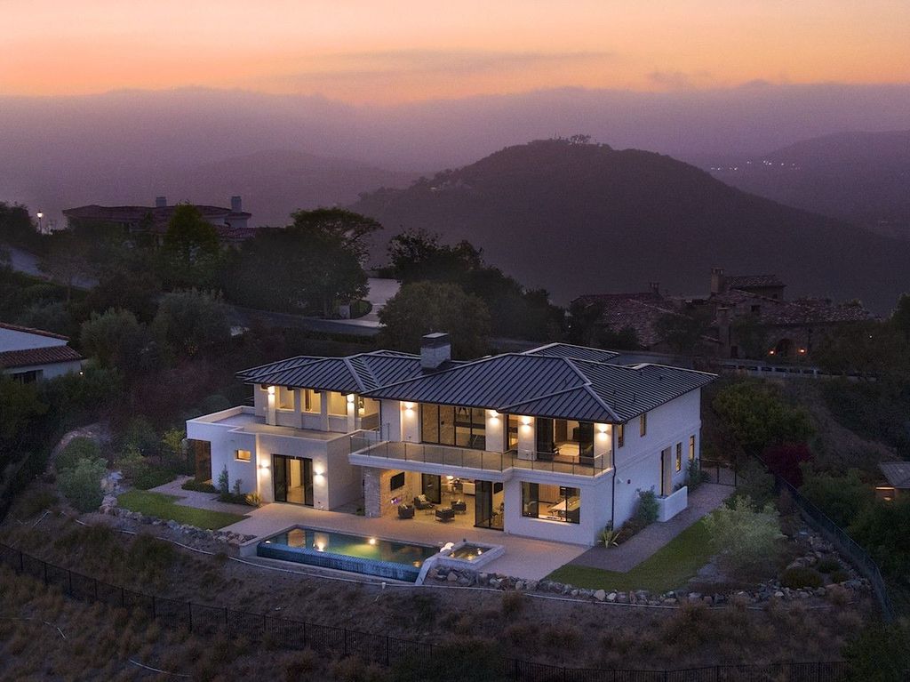 The Home in Rancho Santa Fe is a custom-built, two-story residence in the coveted Cielo community features breathtaking views now available for sale. This home located at 7923 Camino De Arriba, Rancho Santa Fe, California