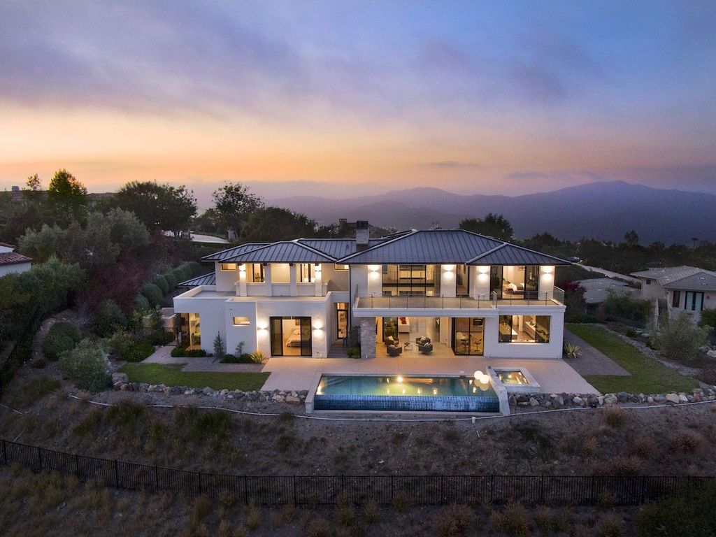 The Home in Rancho Santa Fe is a custom-built, two-story residence in the coveted Cielo community features breathtaking views now available for sale. This home located at 7923 Camino De Arriba, Rancho Santa Fe, California