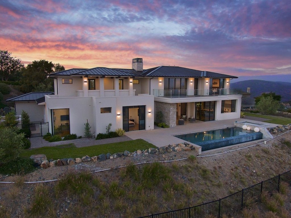 The Home in Rancho Santa Fe is a custom-built, two-story residence in the coveted Cielo community features breathtaking views now available for sale. This home located at 7923 Camino De Arriba, Rancho Santa Fe, California