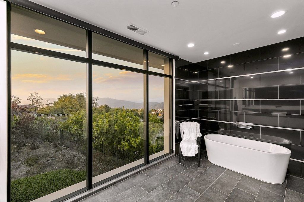 The Home in Rancho Santa Fe is a custom-built, two-story residence in the coveted Cielo community features breathtaking views now available for sale. This home located at 7923 Camino De Arriba, Rancho Santa Fe, California