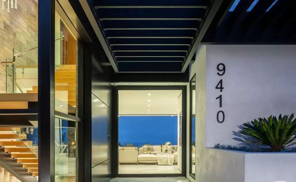 The Home in Hollywood Hills is a brand new contemporary masterpiece with unparalleled finishes and museum-quality materials now available for sale. This home located at 9410 Sierra Mar Pl, Los Angeles, California