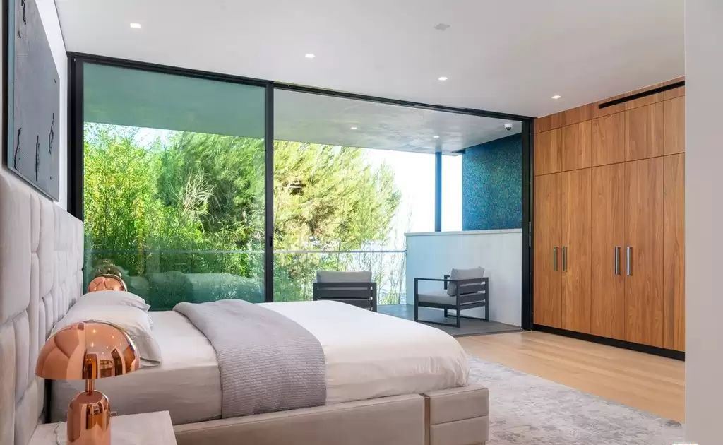 The Home in Hollywood Hills is a brand new contemporary masterpiece with unparalleled finishes and museum-quality materials now available for sale. This home located at 9410 Sierra Mar Pl, Los Angeles, California