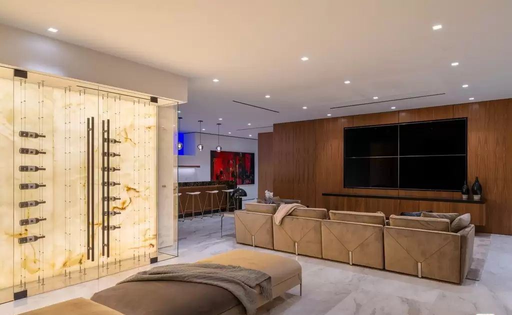 The Home in Hollywood Hills is a brand new contemporary masterpiece with unparalleled finishes and museum-quality materials now available for sale. This home located at 9410 Sierra Mar Pl, Los Angeles, California