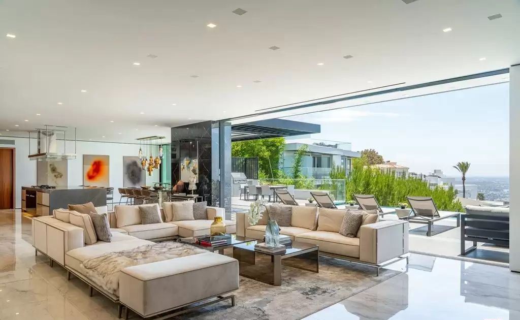 The Home in Hollywood Hills is a brand new contemporary masterpiece with unparalleled finishes and museum-quality materials now available for sale. This home located at 9410 Sierra Mar Pl, Los Angeles, California