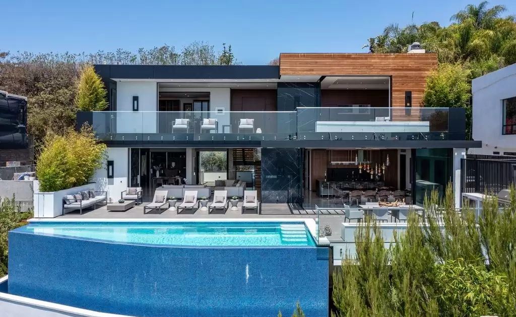 The Home in Hollywood Hills is a brand new contemporary masterpiece with unparalleled finishes and museum-quality materials now available for sale. This home located at 9410 Sierra Mar Pl, Los Angeles, California