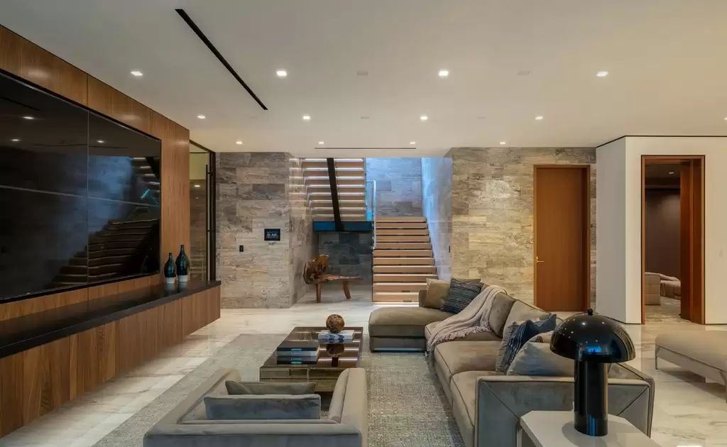 The Home in Hollywood Hills is a brand new contemporary masterpiece with unparalleled finishes and museum-quality materials now available for sale. This home located at 9410 Sierra Mar Pl, Los Angeles, California
