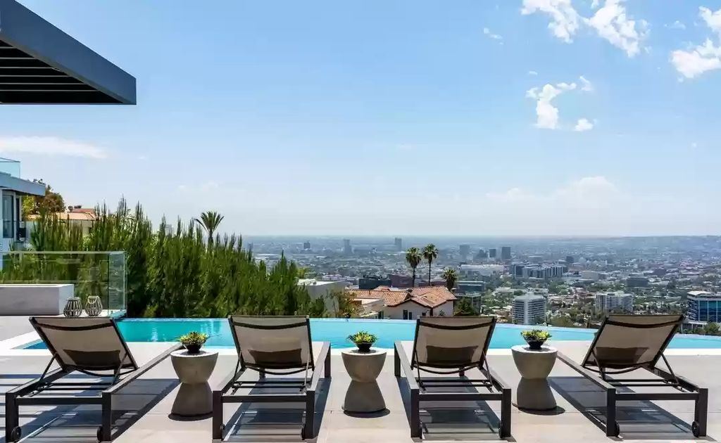 The Home in Hollywood Hills is a brand new contemporary masterpiece with unparalleled finishes and museum-quality materials now available for sale. This home located at 9410 Sierra Mar Pl, Los Angeles, California