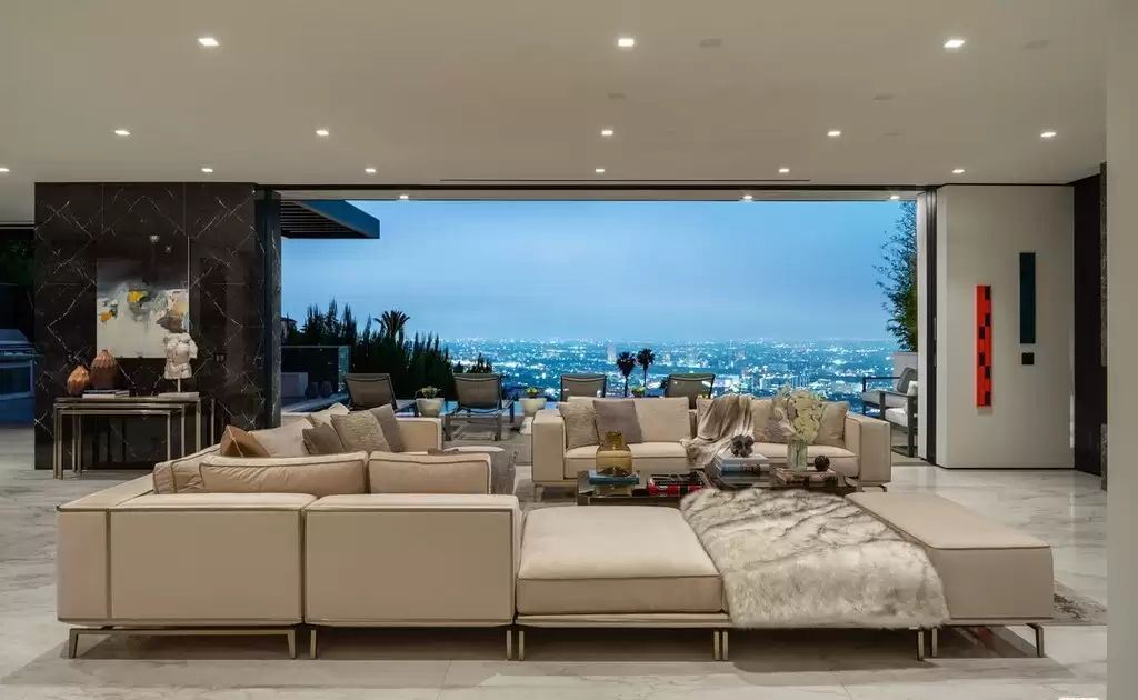 The Home in Hollywood Hills is a brand new contemporary masterpiece with unparalleled finishes and museum-quality materials now available for sale. This home located at 9410 Sierra Mar Pl, Los Angeles, California