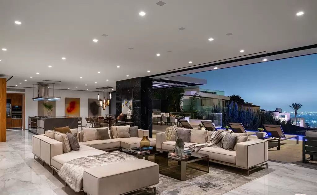 The Home in Hollywood Hills is a brand new contemporary masterpiece with unparalleled finishes and museum-quality materials now available for sale. This home located at 9410 Sierra Mar Pl, Los Angeles, California