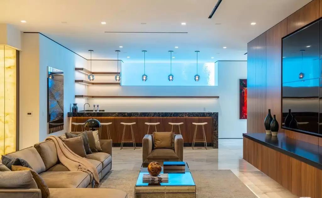 The Home in Hollywood Hills is a brand new contemporary masterpiece with unparalleled finishes and museum-quality materials now available for sale. This home located at 9410 Sierra Mar Pl, Los Angeles, California