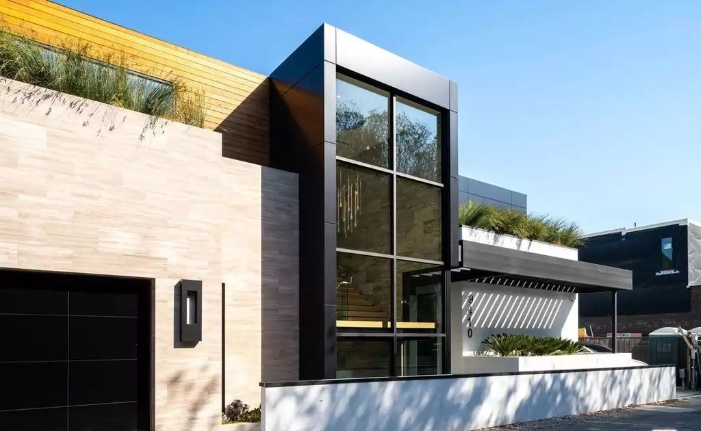 The Home in Hollywood Hills is a brand new contemporary masterpiece with unparalleled finishes and museum-quality materials now available for sale. This home located at 9410 Sierra Mar Pl, Los Angeles, California