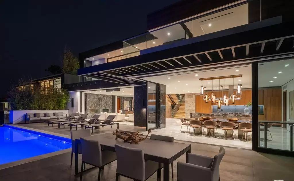 The Home in Hollywood Hills is a brand new contemporary masterpiece with unparalleled finishes and museum-quality materials now available for sale. This home located at 9410 Sierra Mar Pl, Los Angeles, California