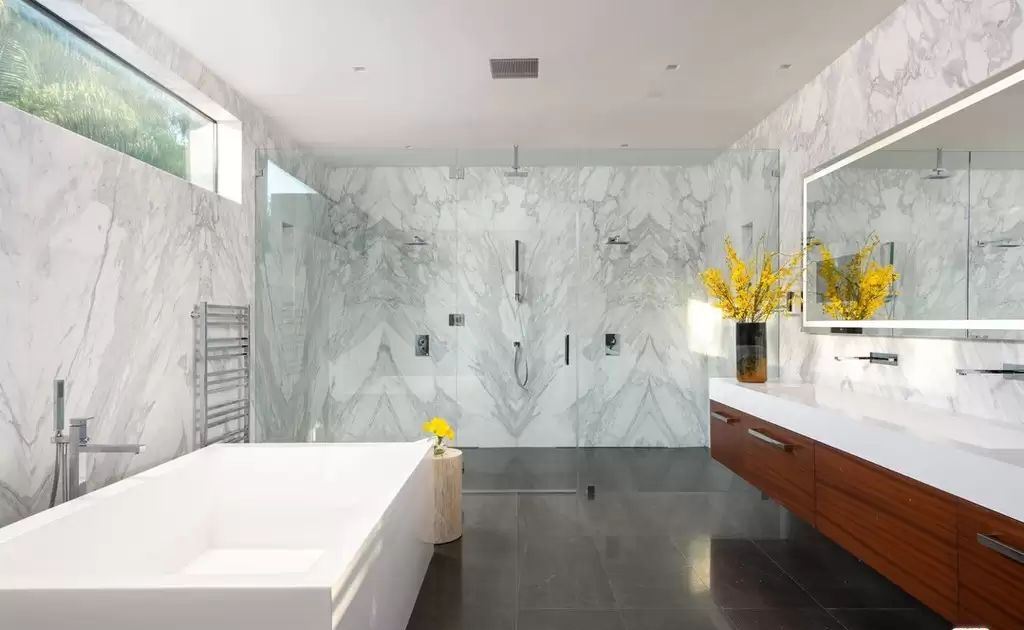 The Home in Hollywood Hills is a brand new contemporary masterpiece with unparalleled finishes and museum-quality materials now available for sale. This home located at 9410 Sierra Mar Pl, Los Angeles, California