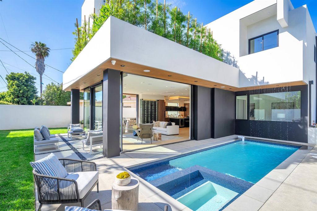 The House in Los Angeles is a brand new estate built from the ground-up with one-of-a-kind high-end features throughout now available for sale. This home located at 3547 Barry Ave, Los Angeles, California