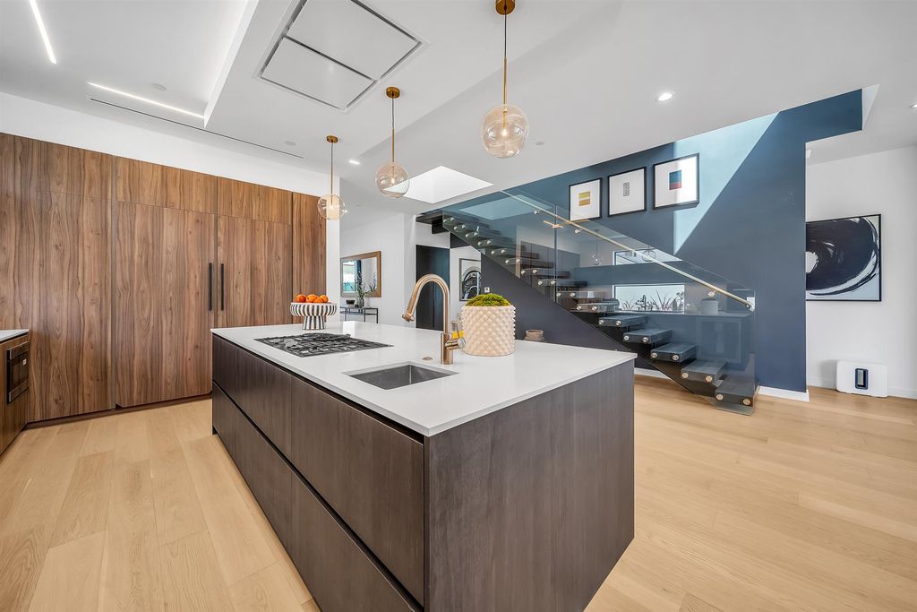 The House in Los Angeles is a brand new estate built from the ground-up with one-of-a-kind high-end features throughout now available for sale. This home located at 3547 Barry Ave, Los Angeles, California