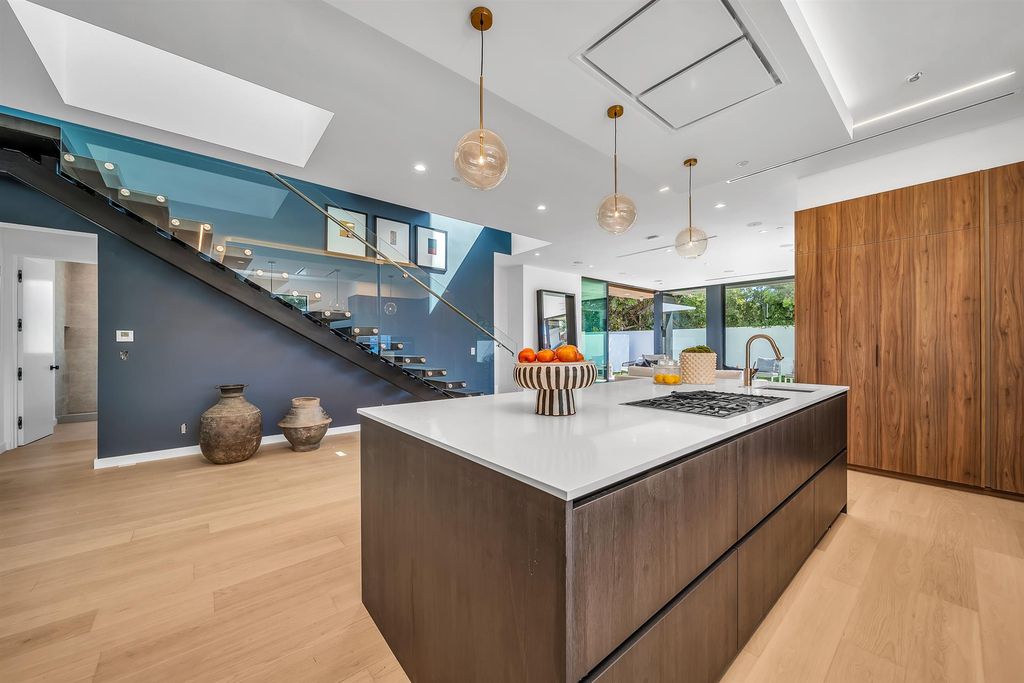 The House in Los Angeles is a brand new estate built from the ground-up with one-of-a-kind high-end features throughout now available for sale. This home located at 3547 Barry Ave, Los Angeles, California