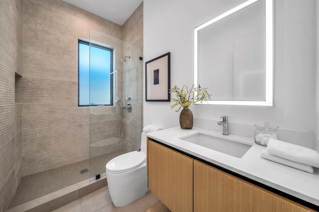 The House in Los Angeles is a brand new estate built from the ground-up with one-of-a-kind high-end features throughout now available for sale. This home located at 3547 Barry Ave, Los Angeles, California