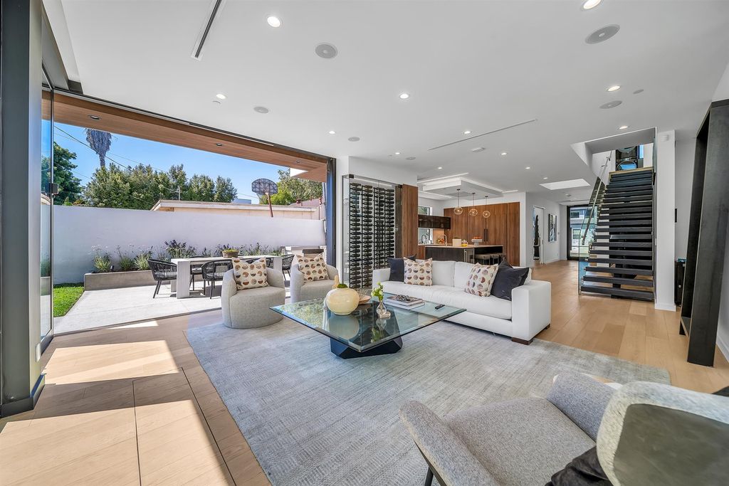 The House in Los Angeles is a brand new estate built from the ground-up with one-of-a-kind high-end features throughout now available for sale. This home located at 3547 Barry Ave, Los Angeles, California