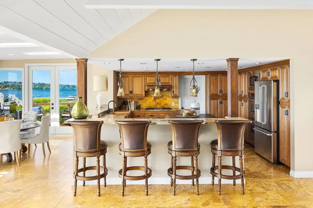 The Waterfront Home in Washington offers shimmering views of the water, city & mountains now available for sale. This home is located at 3261 Evergreen Point Rd, Medina, Washington