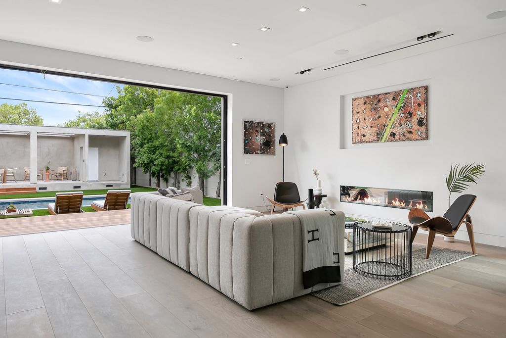 The Home in Los Angeles is a 2021 construction with exquisite Italian finishes featuring rooftop deck, basement and large lot now available for sale. This home located at 716 N Fuller Ave, Los Angeles, California