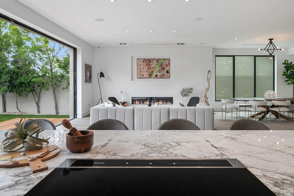 The Home in Los Angeles is a 2021 construction with exquisite Italian finishes featuring rooftop deck, basement and large lot now available for sale. This home located at 716 N Fuller Ave, Los Angeles, California