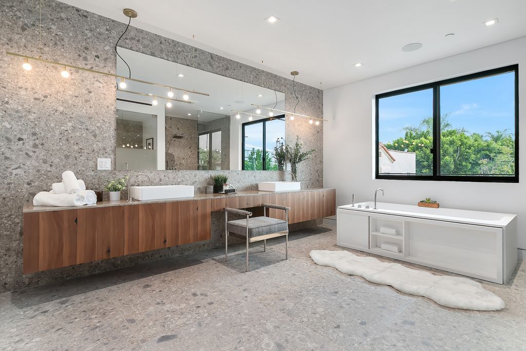 The Home in Los Angeles is a 2021 construction with exquisite Italian finishes featuring rooftop deck, basement and large lot now available for sale. This home located at 716 N Fuller Ave, Los Angeles, California