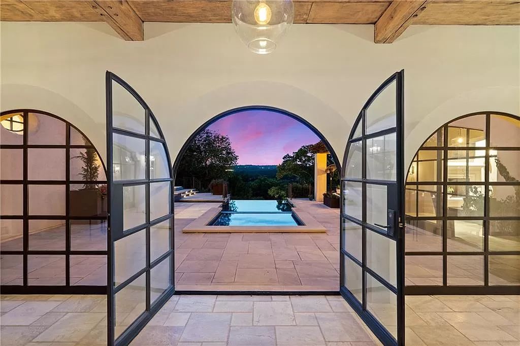 The Home in Austin is an incredible modern Santa Barbara resort style property with panoramic views of the hill country now available for sale. This home located at 4716 Pecan Chase, Austin, Texas