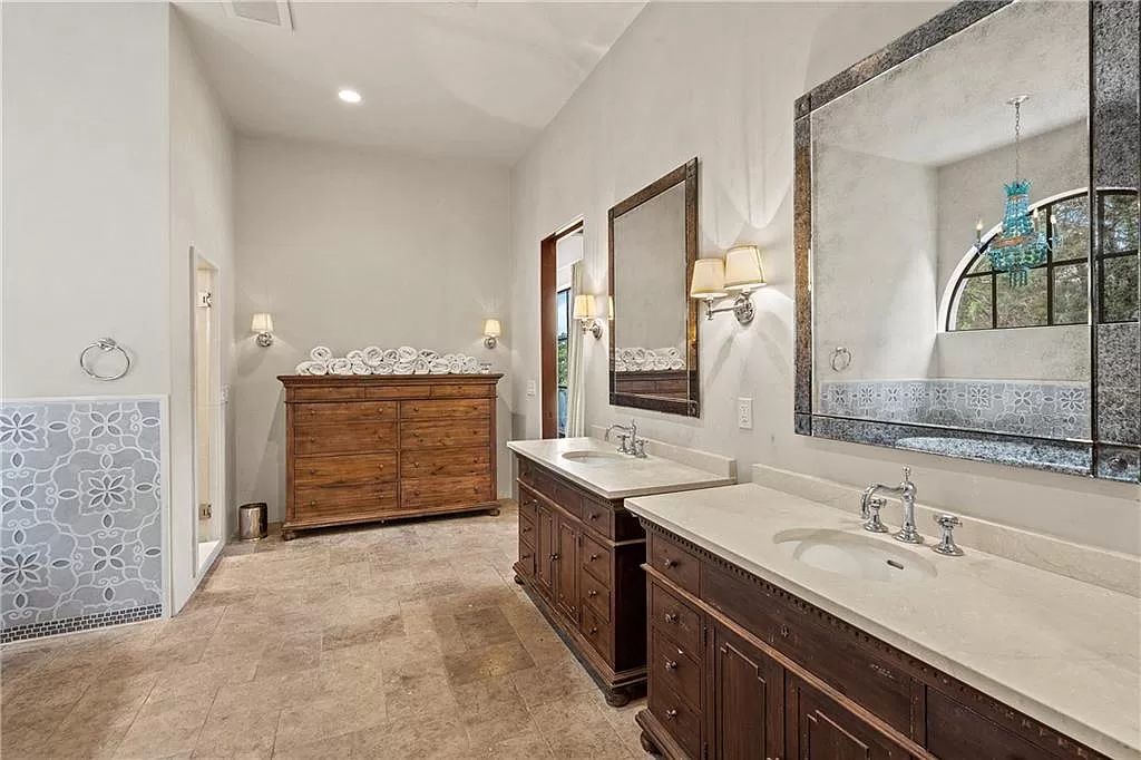 The Home in Austin is an incredible modern Santa Barbara resort style property with panoramic views of the hill country now available for sale. This home located at 4716 Pecan Chase, Austin, Texas