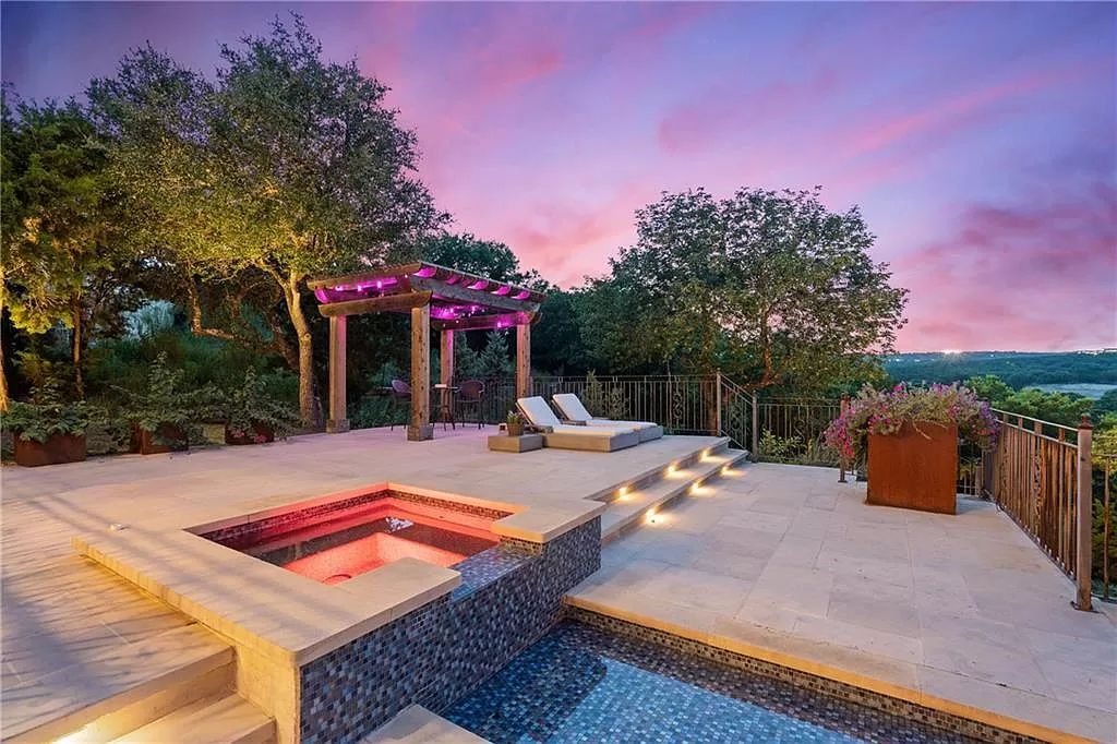 The Home in Austin is an incredible modern Santa Barbara resort style property with panoramic views of the hill country now available for sale. This home located at 4716 Pecan Chase, Austin, Texas