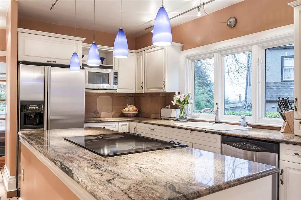The Lovely House in Vancouver is surrounded by incredible gardens now available for sale. This home is located at 2588 Courtenay St, Vancouver, BC V6R 3X3, Canada