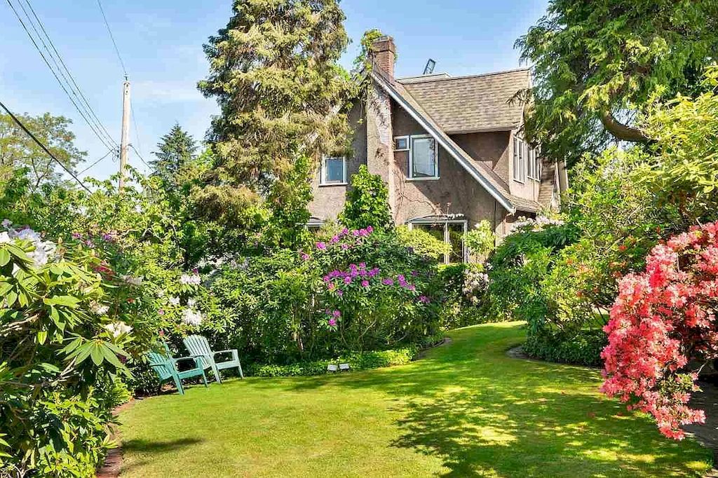 The Lovely House in Vancouver is surrounded by incredible gardens now available for sale. This home is located at 2588 Courtenay St, Vancouver, BC V6R 3X3, Canada