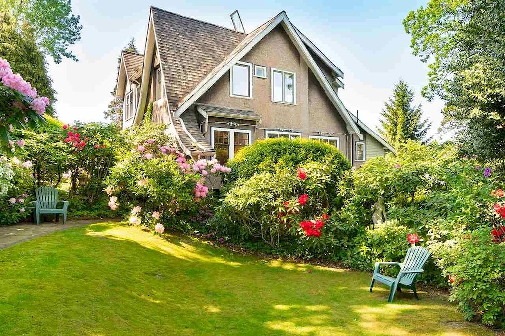 The Lovely House in Vancouver is surrounded by incredible gardens now available for sale. This home is located at 2588 Courtenay St, Vancouver, BC V6R 3X3, Canada