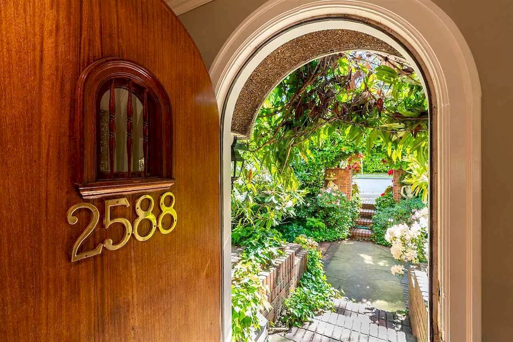 The Lovely House in Vancouver is surrounded by incredible gardens now available for sale. This home is located at 2588 Courtenay St, Vancouver, BC V6R 3X3, Canada